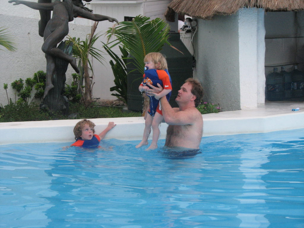 Dad playing with the boys in our pool Oleo Cancun