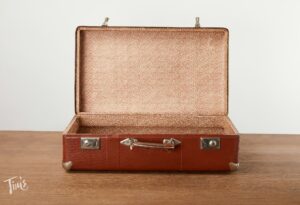 Empty suitcase ready to pack for a Cancun vacation at Tim’s Ocean Condos.