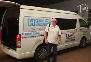 This is Tim, the owner of Tim's Ocean Condos, standing in front of the USA Transfer Shuttle van after just arriving from the Cancun airport.
