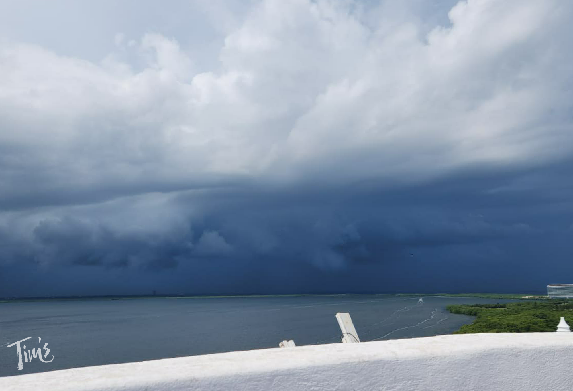Storm clouds forming over Niptuche Lagoon, viewed from the terrace of Penthouse 3000 at Tim’s Ocean Condos in Cancun.