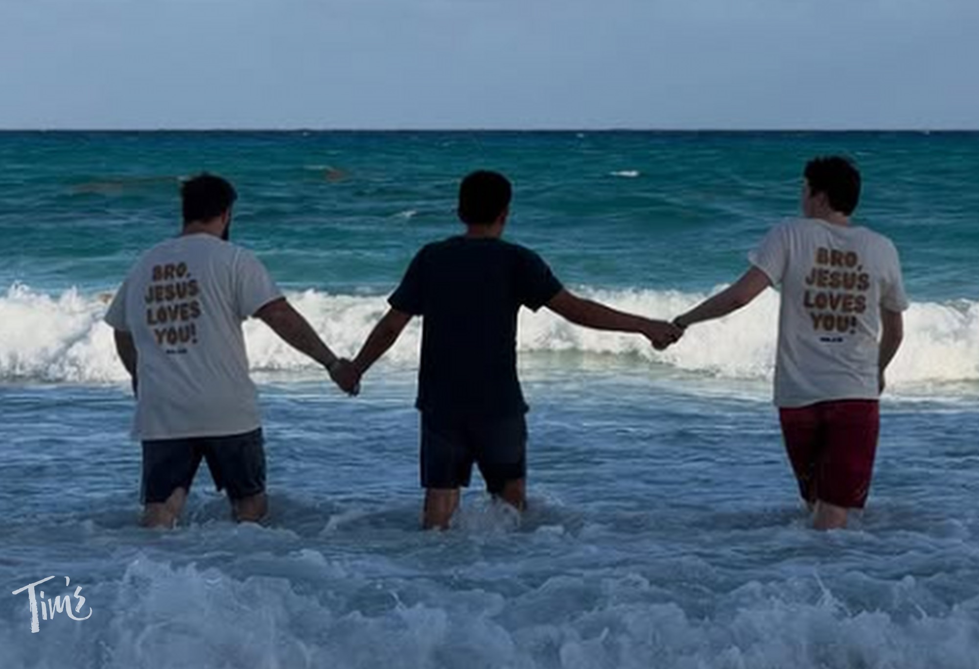 THE FOUR outreach team leading man into ocean for baptism in Cancun during spring break 2026