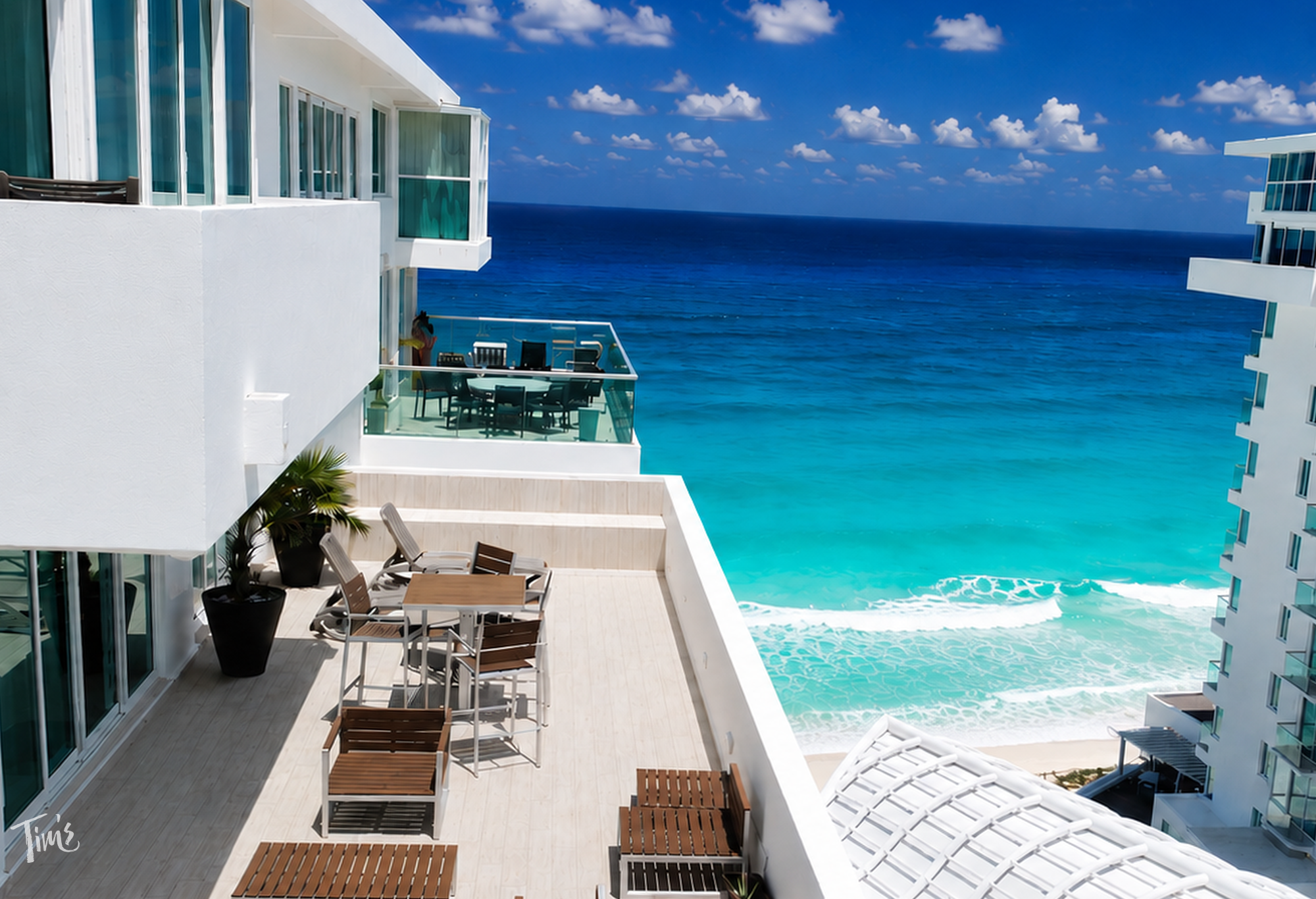 Private oceanfront terrace at Penthouse 2704 overlooking the Caribbean Sea at Tim's Ocean Condos vacation rental Cancun.