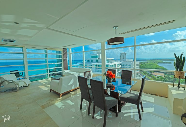 Large Cancun vacation rental with oceanfront living room and dining room at Tim's Ocean Condos